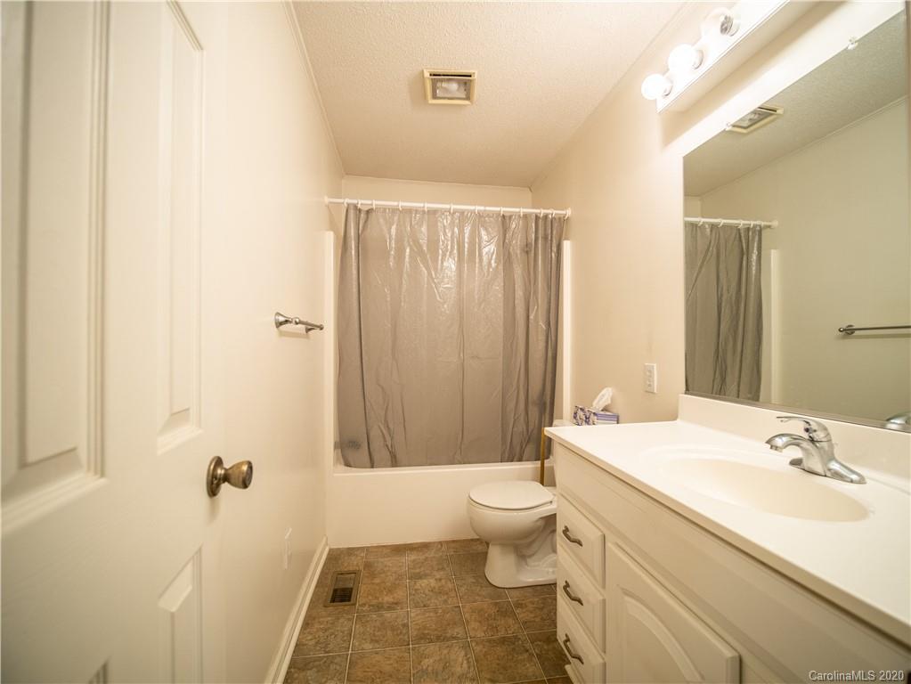 1956 Tradesville Road Lancaster, SC 29720 - Photo 8 of 18 a bathroom with a sink a toilet and shower