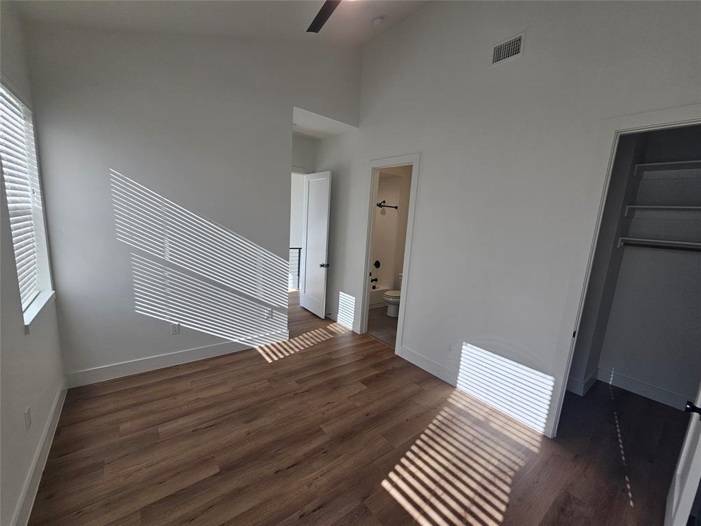 2139 Mail Avenue, Unit 101 Dallas, TX 75235 - Photo 15 of 21 a view of a livingroom with wooden floor and stairs