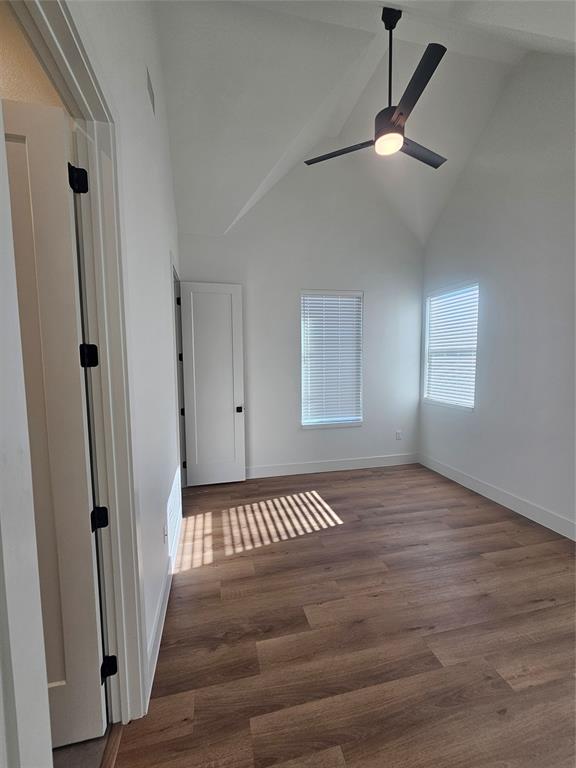 2139 Mail Avenue, Unit 101 Dallas, TX 75235 - Photo 17 of 21 an empty room with wooden floor fan and windows