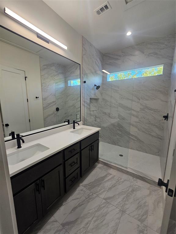 2139 Mail Avenue, Unit 101 Dallas, TX 75235 - Photo 21 of 21 a bathroom with a double vanity sink mirror double and shower