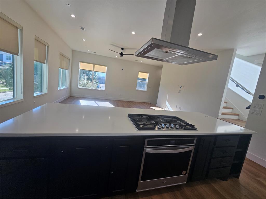 2139 Mail Avenue, Unit 101 Dallas, TX 75235 - Photo 8 of 21 a view of kitchen with a stove a microwave and wooden floor