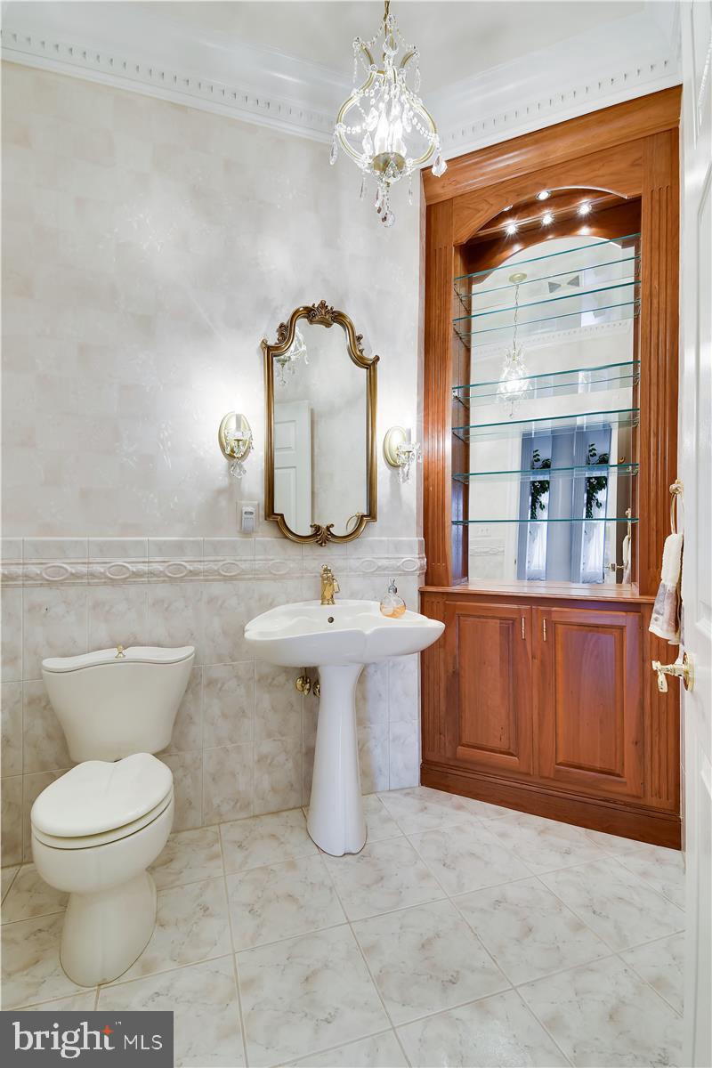 40887 Robin Circle Leesburg, VA 20175 - Photo 38 of 100 Main level powder room with built in cabinetry