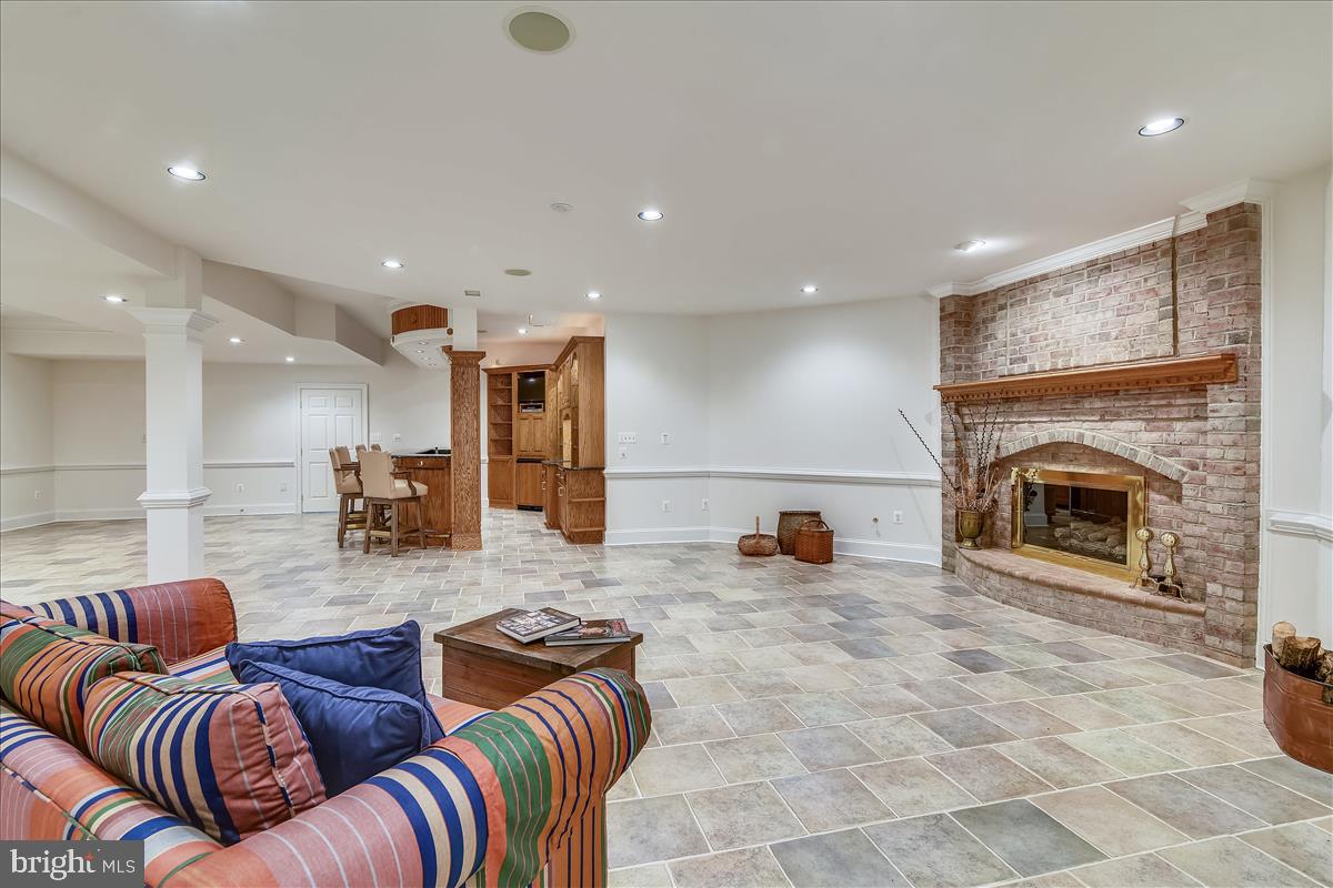 40887 Robin Circle Leesburg, VA 20175 - Photo 61 of 100 Huge finished LL rec room; raised hearth brick FP