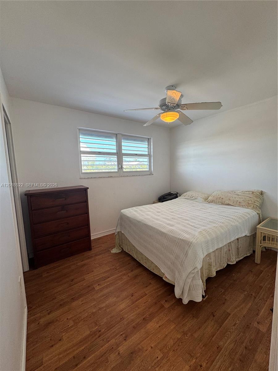 4276 Dorn Road Summerland Key, FL 33042 - Photo 11 of 23 a bedroom with a bed a dresser and window
