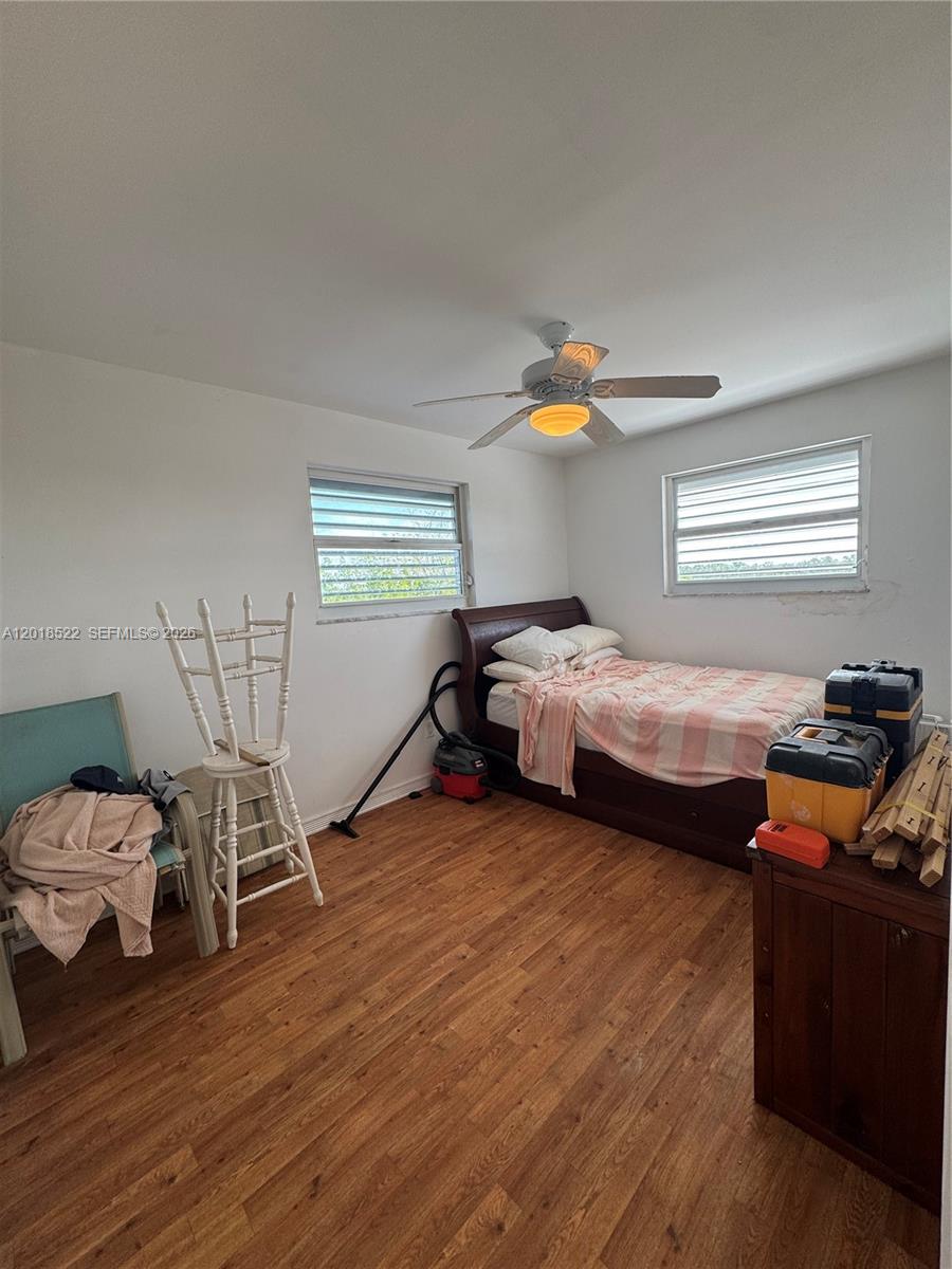 4276 Dorn Road Summerland Key, FL 33042 - Photo 12 of 23 a bedroom with two beds and wooden floor