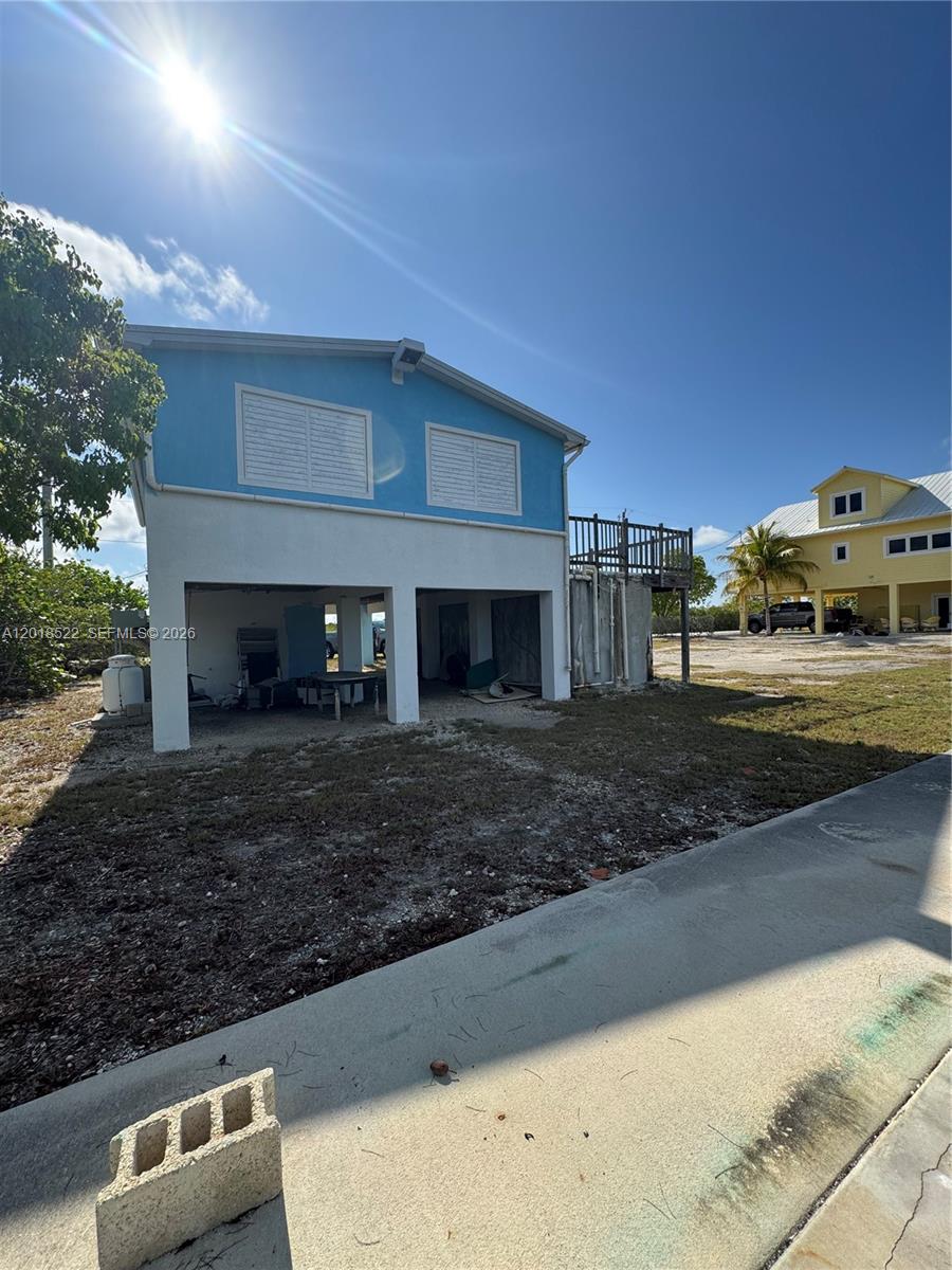4276 Dorn Road Summerland Key, FL 33042 - Photo 14 of 23 a view of a yard with car parked