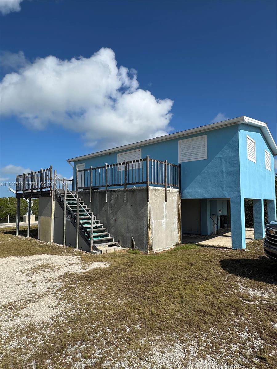 4276 Dorn Road Summerland Key, FL 33042 - Photo 16 of 23 a view of a terrace with a chair