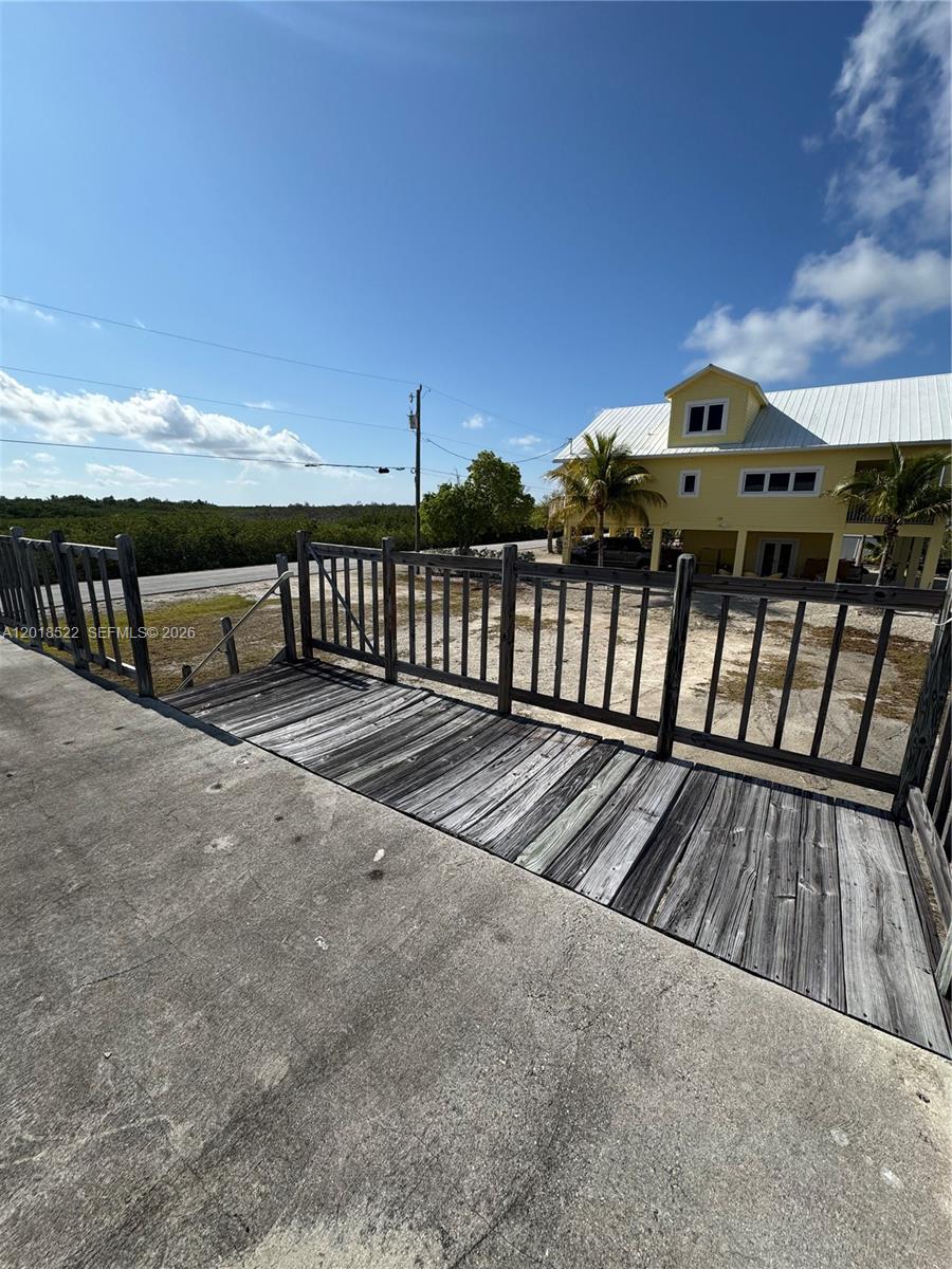 4276 Dorn Road Summerland Key, FL 33042 - Photo 3 of 23 a view of a balcony with wooden floor