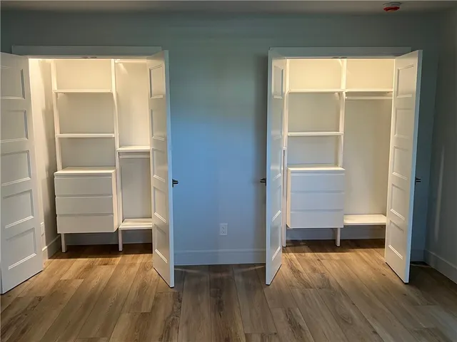 a view of room with wooden floor and window