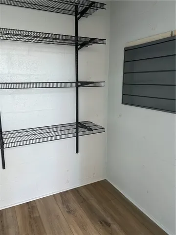 a view of a room with racks on the wall