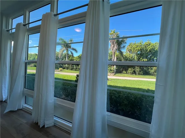 a view of a glass door with a outdoor space