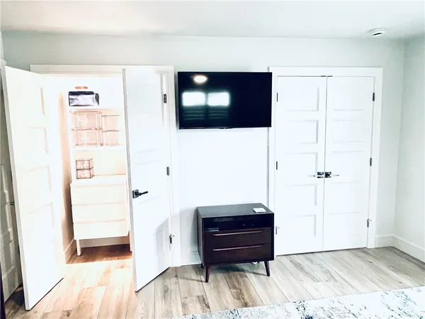 a view of a living room with a flat screen tv