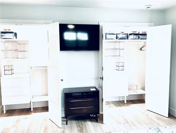 a view of a living room with a bed and furniture