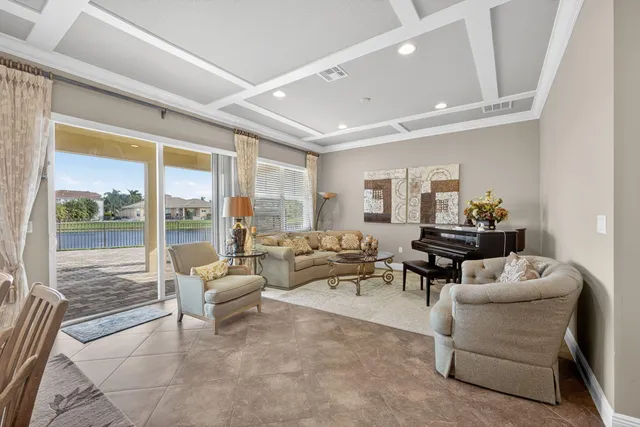 a kitchen with kitchen island granite countertop a sink a counter top space stainless steel appliances and cabinets