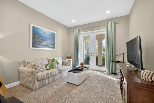 a spacious bedroom with a large bed and a large window