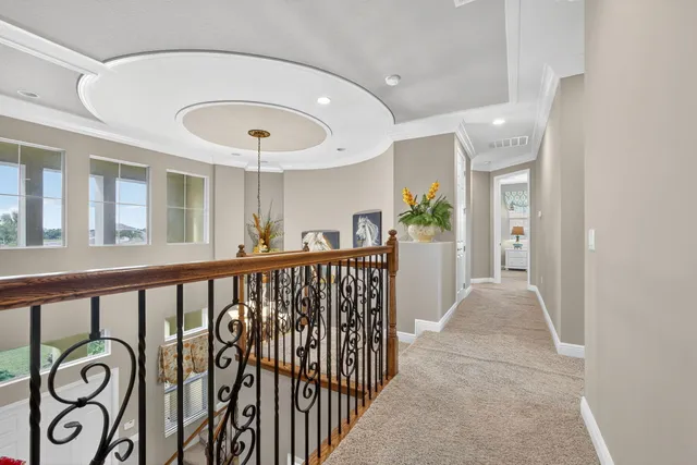 a view of a lake with houses in the background