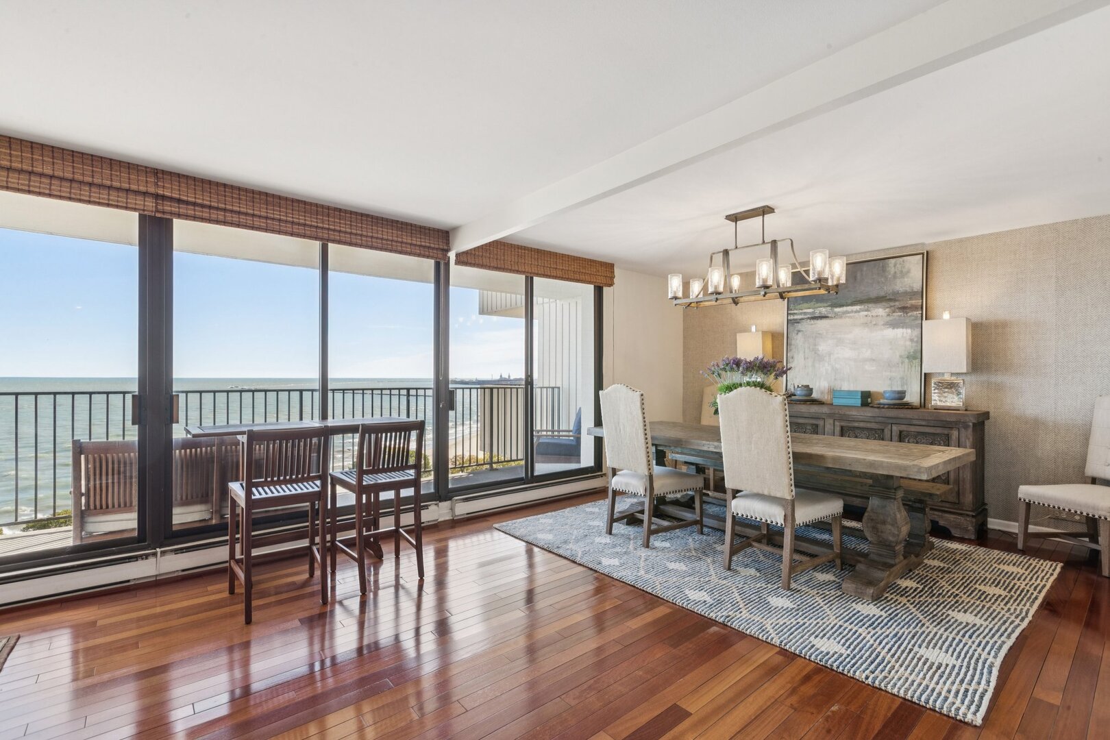 1212 North Lake Shore Drive, Unit 10CS Chicago, IL 60610 - Photo 18 of 65 a living room with furniture large windows and wooden floor