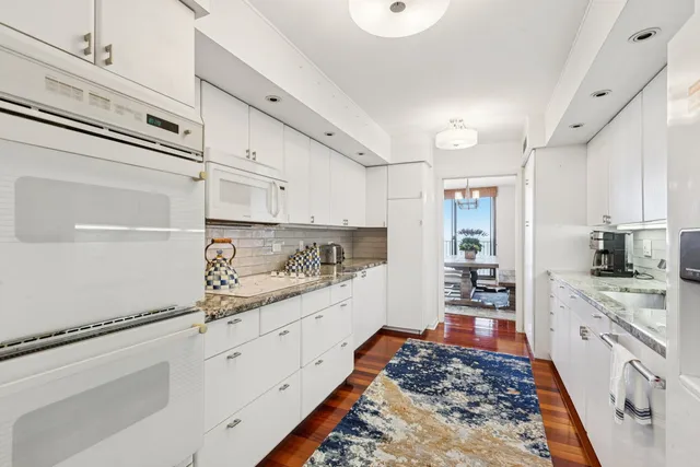 a kitchen with granite countertop a sink and a granite counter tops