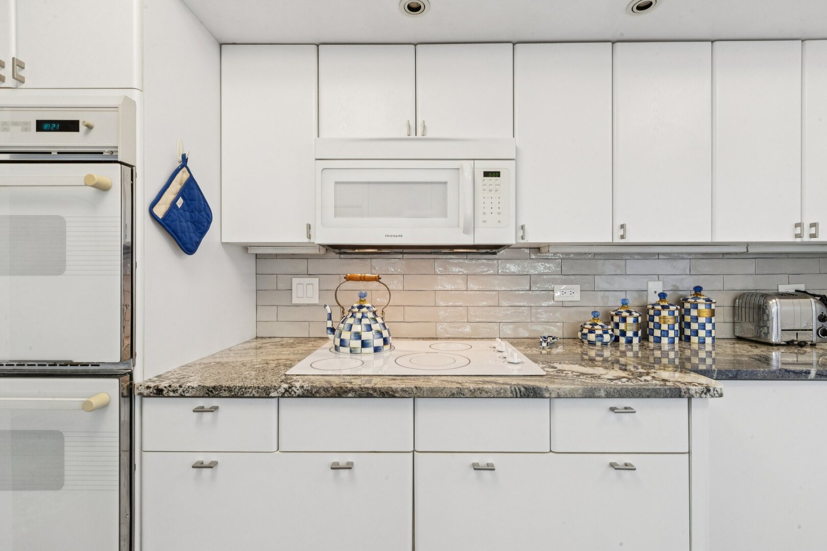 1212 North Lake Shore Drive, Unit 10CS Chicago, IL 60610 - Photo 22 of 65 a kitchen with white cabinets and sink