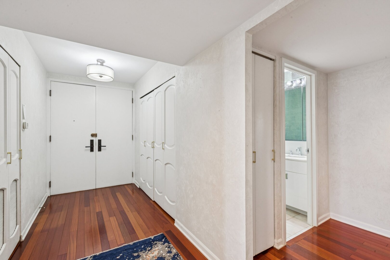 1212 North Lake Shore Drive, Unit 10CS Chicago, IL 60610 - Photo 5 of 65 a view of a hallway with wooden floor and entryway