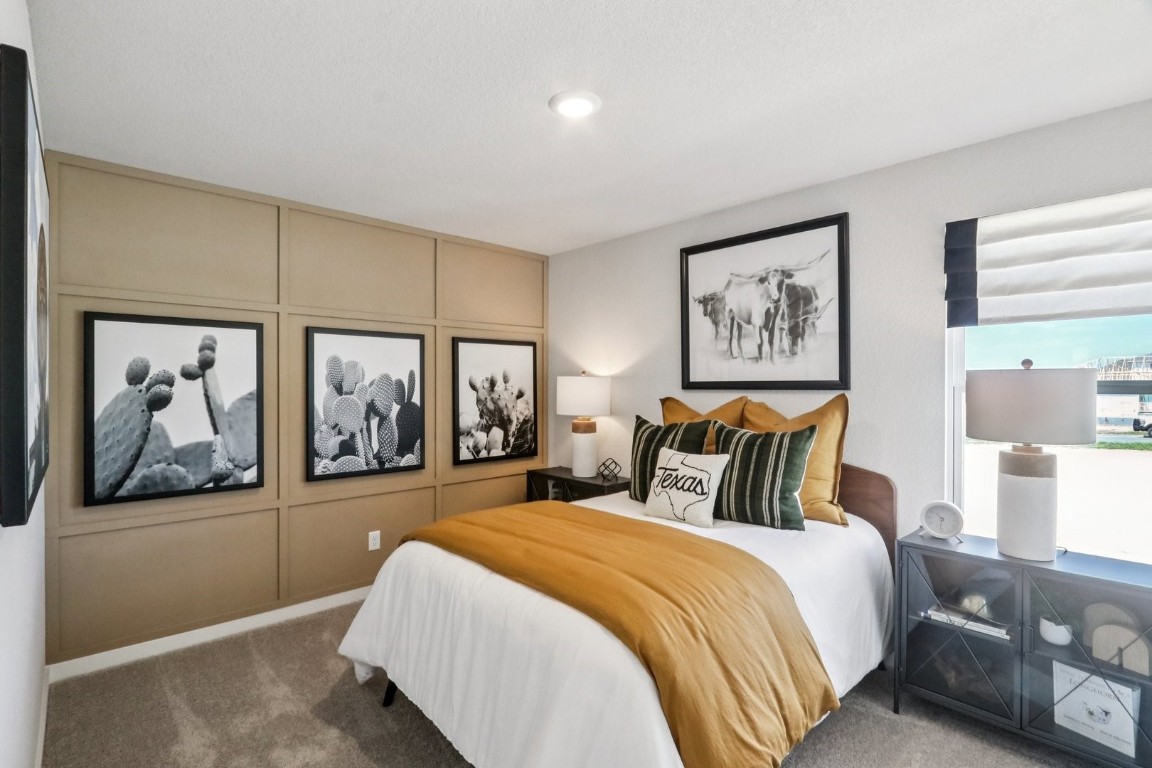 1213 Lavender Way Georgetown, TX 78628 - Photo 13 of 25 a bedroom with a large bed and a painting on the wall