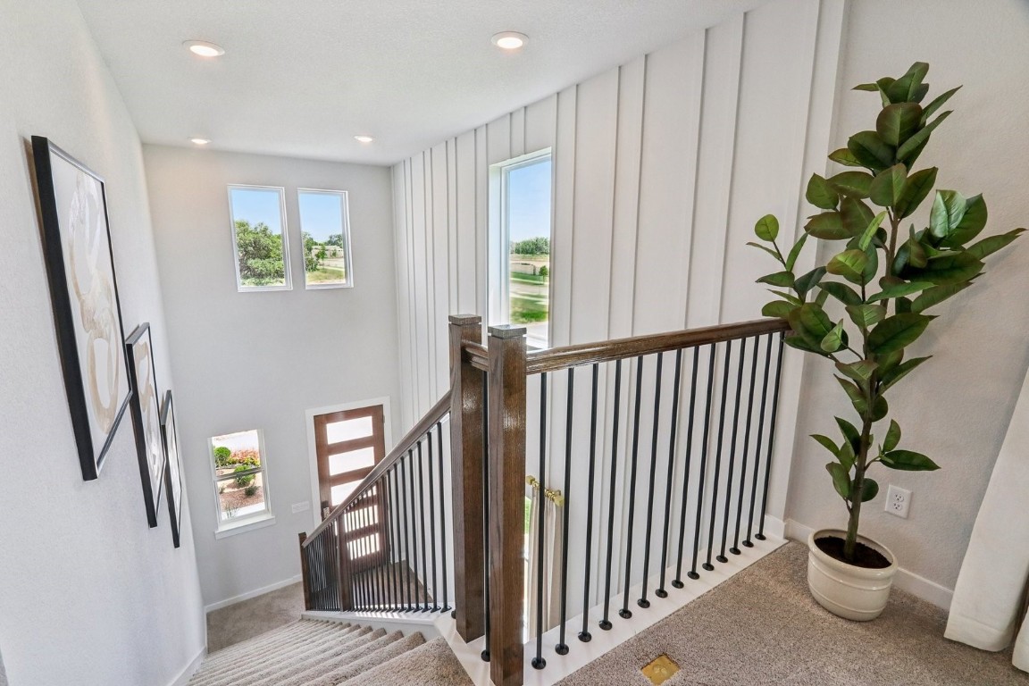 1213 Lavender Way Georgetown, TX 78628 - Photo 18 of 25 a view of a hallway with windows and stairs