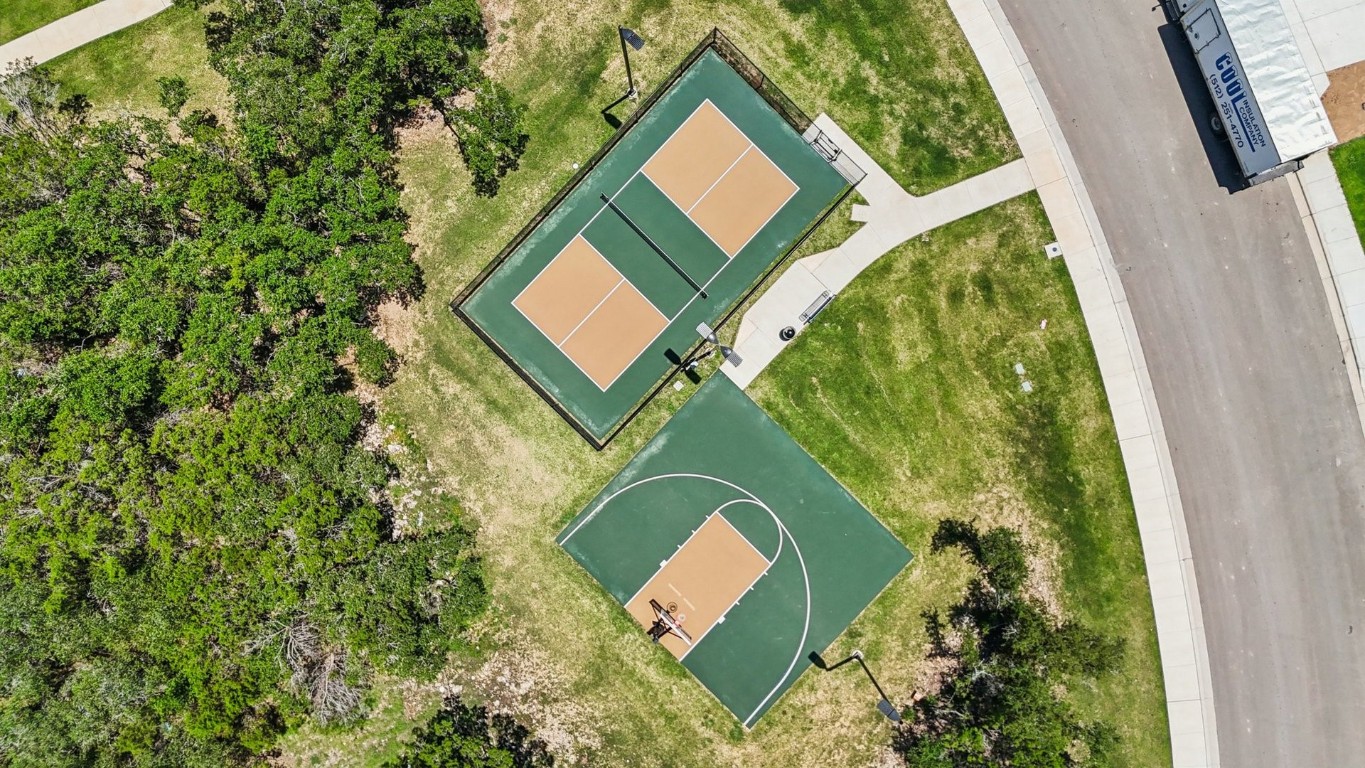1213 Lavender Way Georgetown, TX 78628 - Photo 21 of 25 an aerial view of a house with a yard and garden