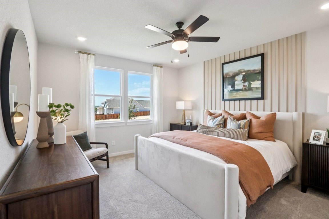 1213 Lavender Way Georgetown, TX 78628 - Photo 8 of 25 a bed room with a bed window and a mirror