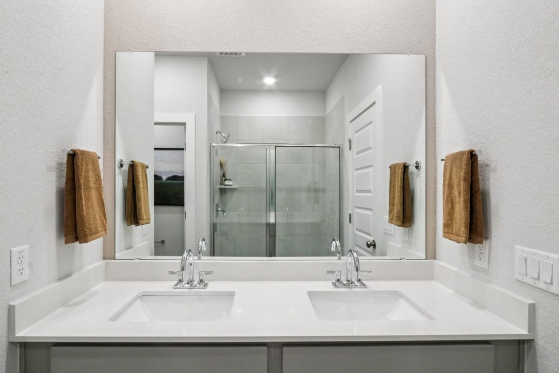 1213 Lavender Way Georgetown, TX 78628 - Photo 10 of 25 a bathroom with a sink and a mirror