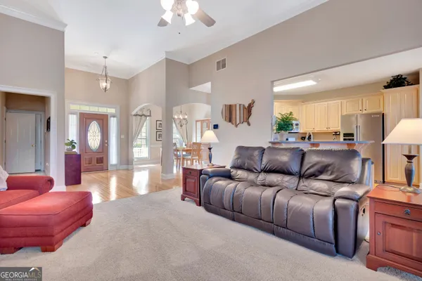 a kitchen with stainless steel appliances a refrigerator and a stove