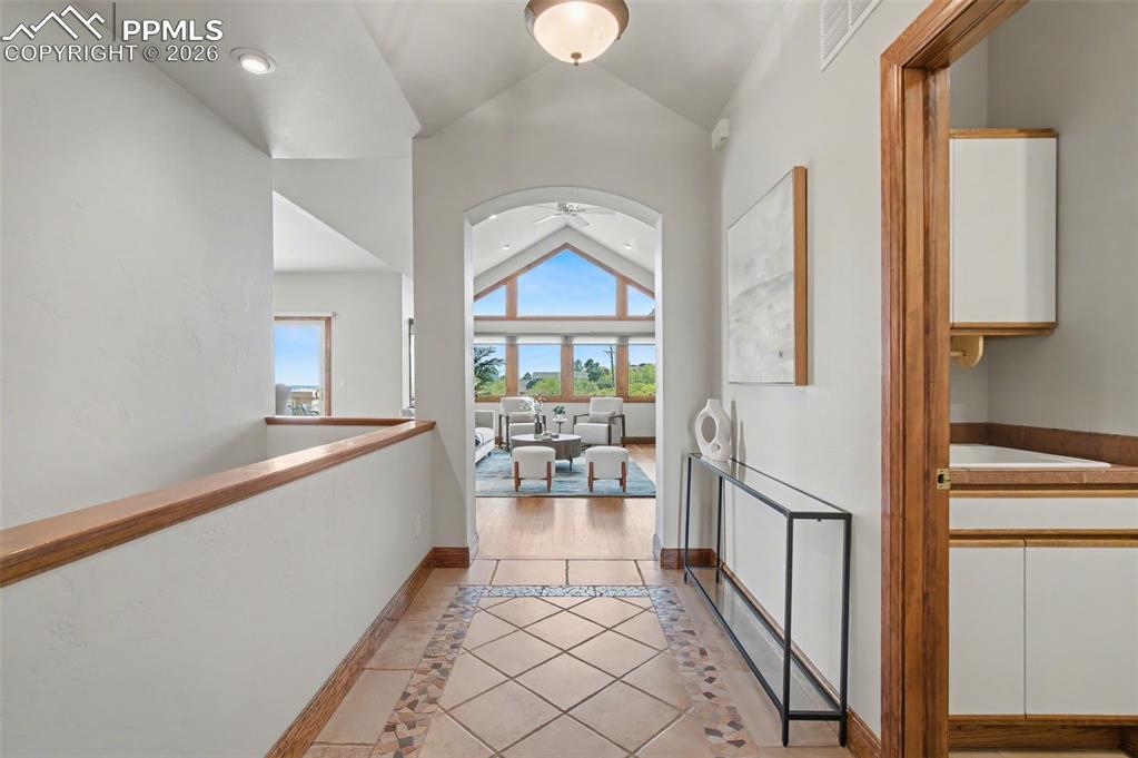 4215 Star Ranch Road Colorado Springs, CO 80906 - Photo 11 of 44 a very nice looking room with a large window and chandelier