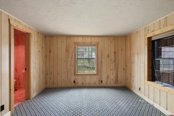 a view of a livingroom with wooden floor