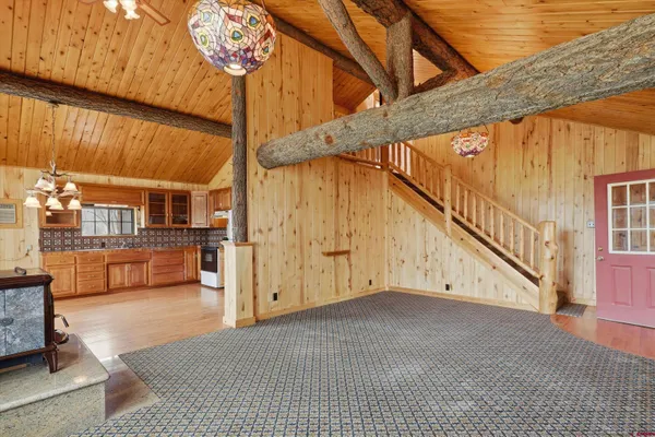 a kitchen with stainless steel appliances granite countertop a refrigerator a oven a sink with dishwasher and cabinets