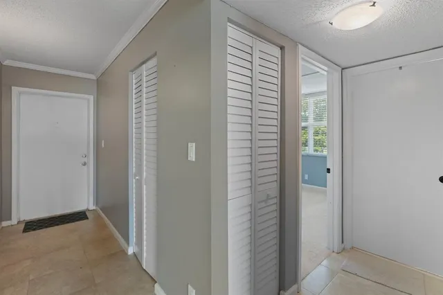 a view of hallway with shower and a window