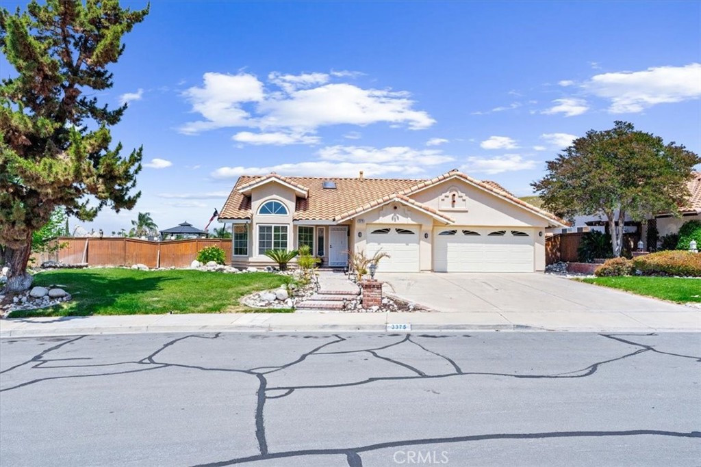 3375 May Court Riverside, CA 92503 - Photo 1 of 1 a front view of a house with a yard and garage