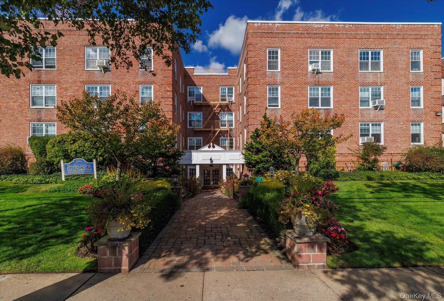 a front view of a building with garden