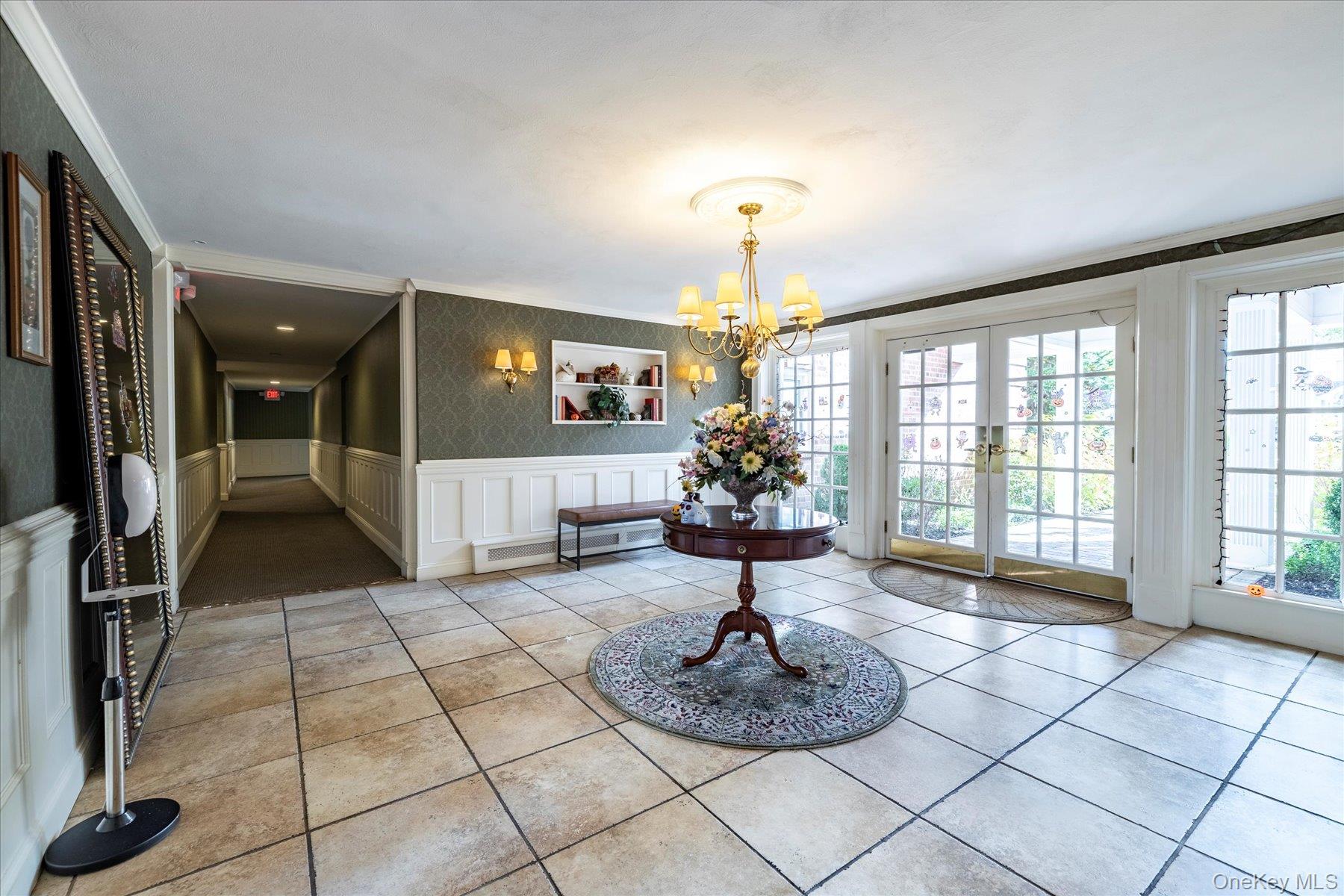 194 Smith Street, Unit 1K Freeport, NY 11520 - Photo 3 of 18 a lobby with furniture and a potted plant
