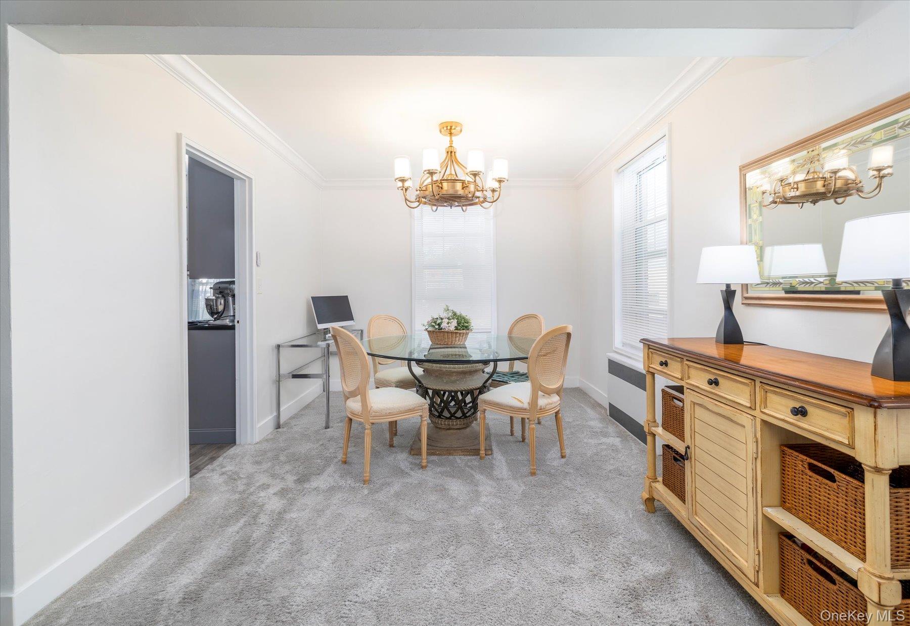 194 Smith Street, Unit 1K Freeport, NY 11520 - Photo 10 of 18 a dining room with furniture and window