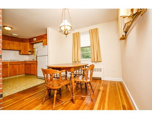 22 Eaton Road Lexington, MA 02420 - Photo 5 of 17 a view of a dining room with furniture and chandelier