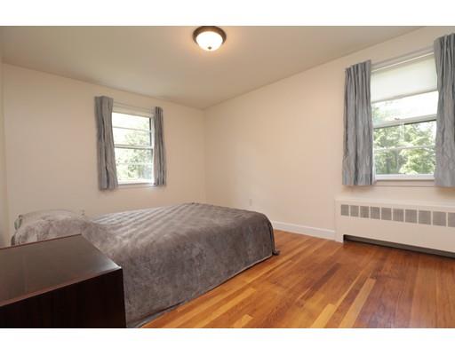 22 Eaton Road Lexington, MA 02420 - Photo 8 of 17 a bedroom with a bed and a window