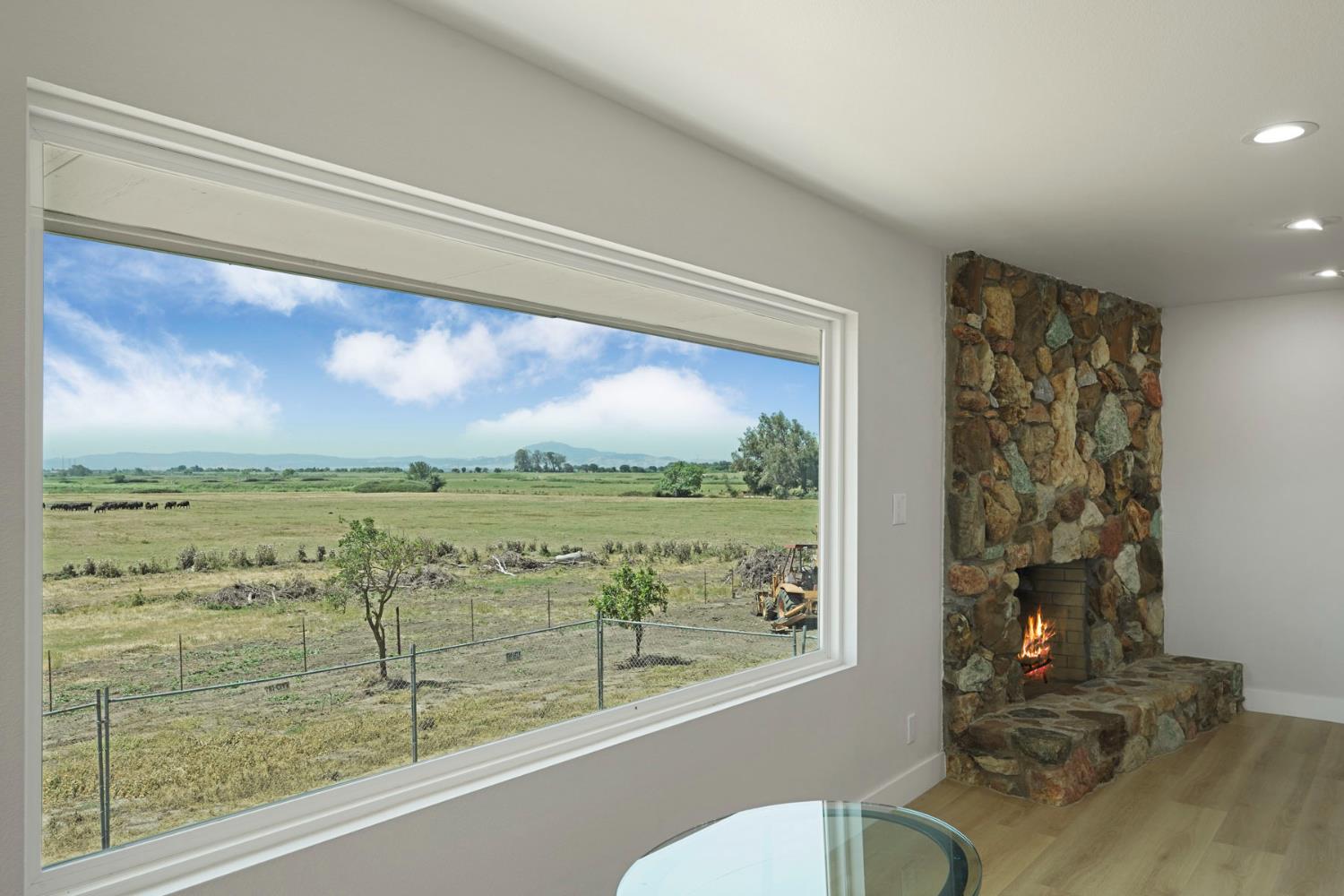 2650 West Twitchell Island Road Rio Vista, CA 94571 - Photo 10 of 60 a view of a floor to ceiling window and an outdoor living room