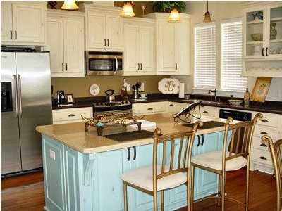 a kitchen with a stove a sink and a refrigerator