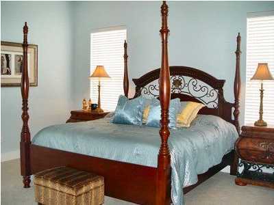 25 Pompano Street Inlet Beach, FL 32461 - Photo 2 of 10 a bedroom with a bed and windows