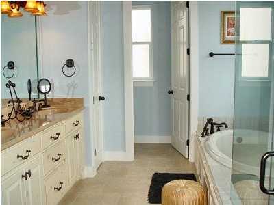 25 Pompano Street Inlet Beach, FL 32461 - Photo 3 of 10 a bathroom with a granite countertop tub sink and mirror