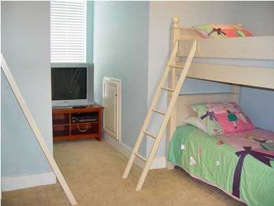 25 Pompano Street Inlet Beach, FL 32461 - Photo 8 of 10 a bedroom with a bed and a chandelier