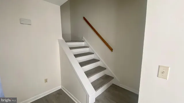 a view of entryway with wooden floor