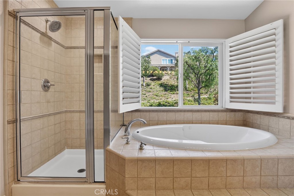 20543 Pesaro Porter Ranch Porter Ranch, CA 91326 - Photo 40 of 67 a bath tub sitting next to a window