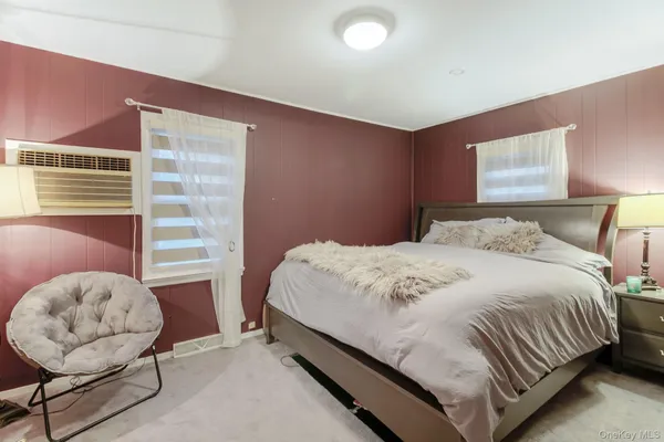 a bedroom with a bed and lamp