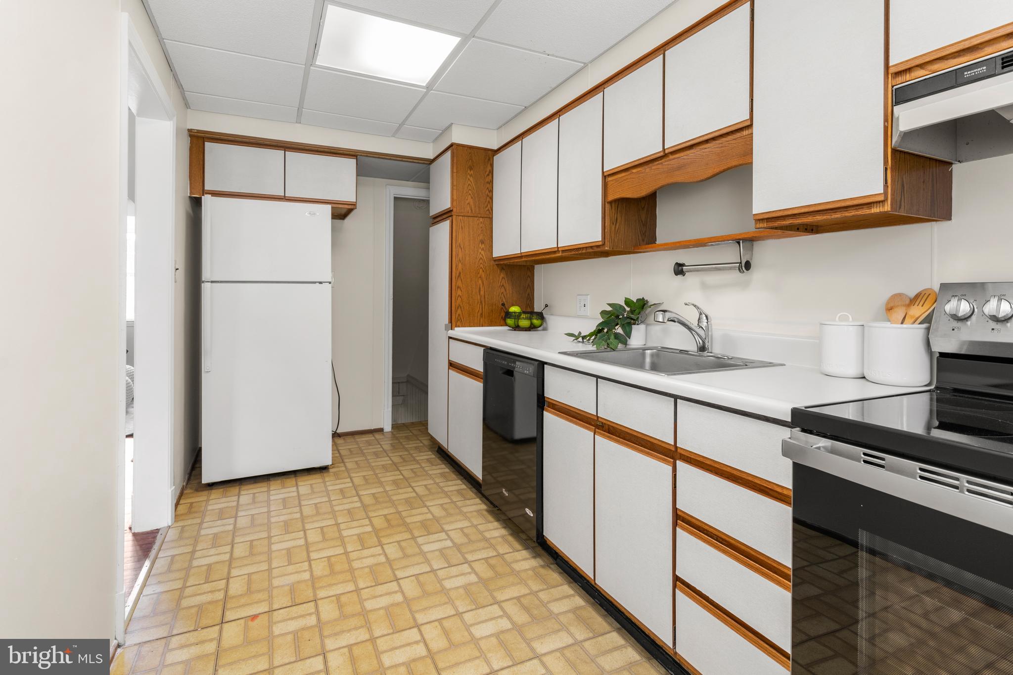 1644 Thetford Road Towson, MD 21286 - Photo 16 of 40 a kitchen with stainless steel appliances granite countertop a refrigerator and a stove