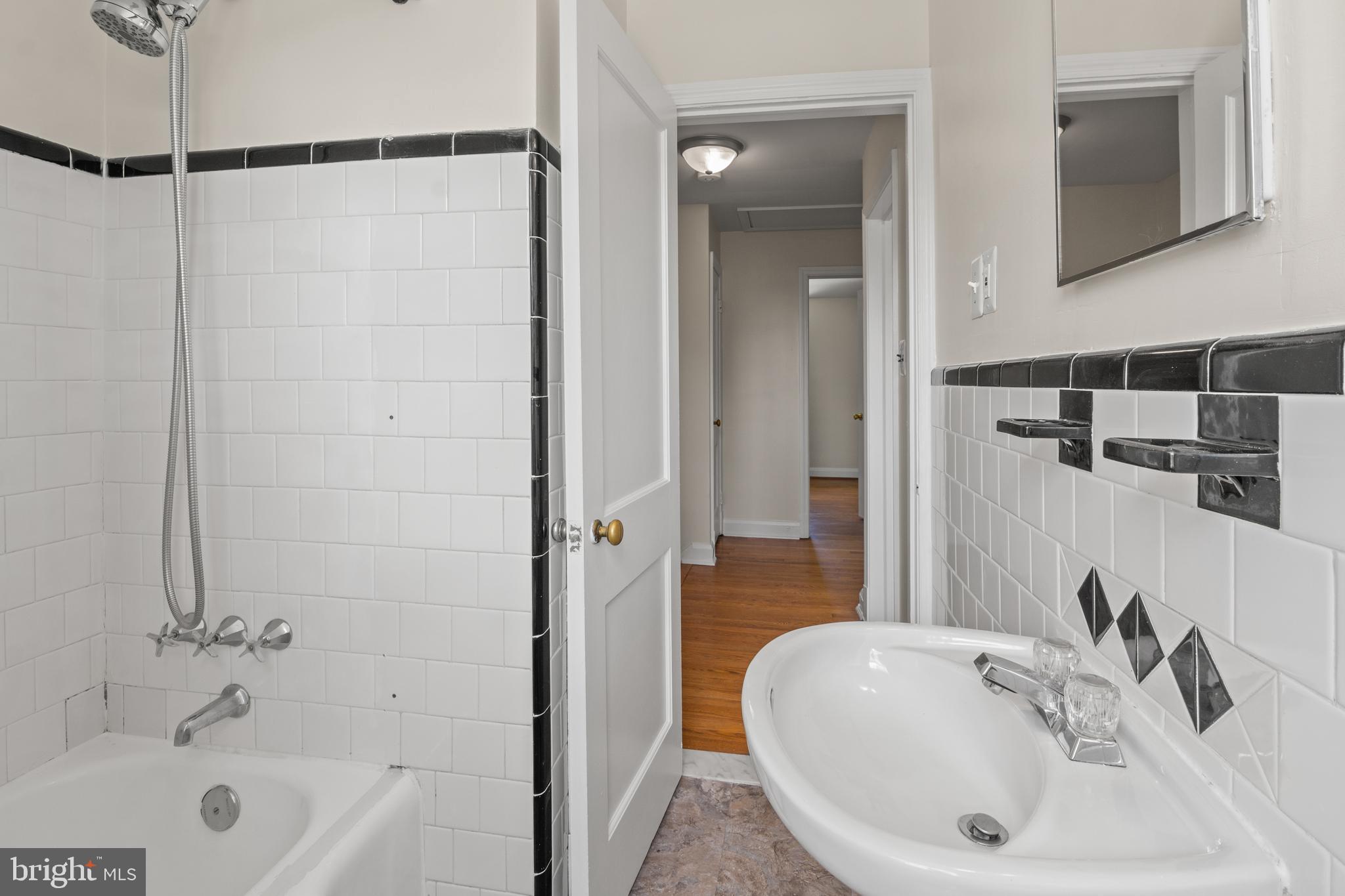 1644 Thetford Road Towson, MD 21286 - Photo 20 of 40 a bathroom with a sink and a mirror